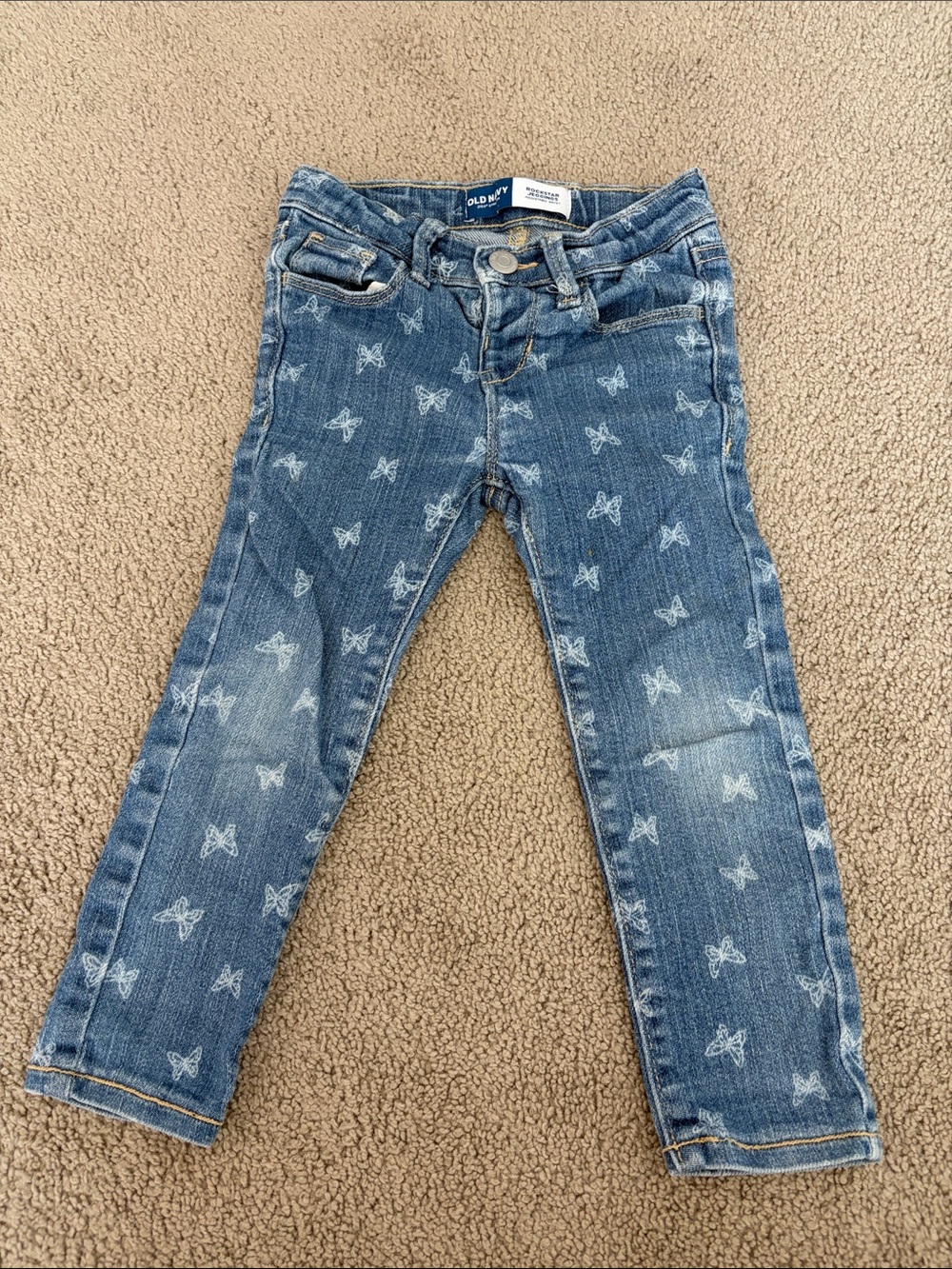Old Navy Blue Skinny Jeans with White Butterfly Print